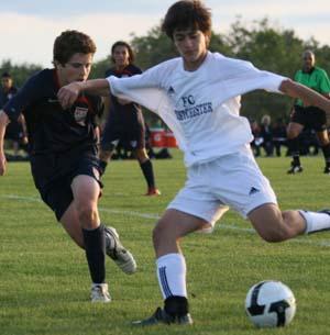 Boys club soccer players compete.