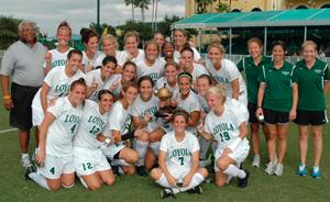 Loyola (MD) women's college soccer players celebrate.