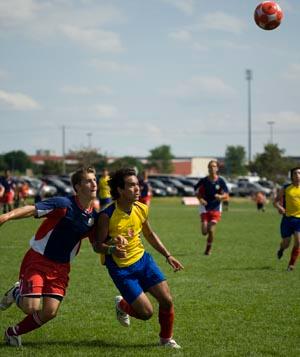 Elite club soccer players compete.