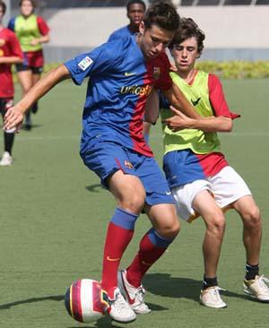 Club soccer players train at a Barcelona soccer camp.