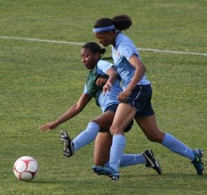 Elite club soccer players compete.