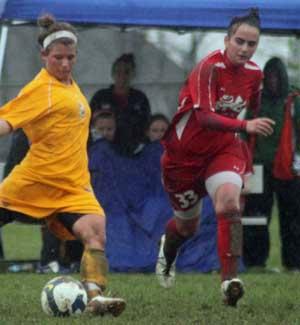 elite girls club soccer players in a club soccer game