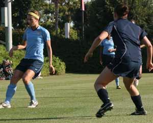 elte girls club and womens college soccer players at a girls soccer camp