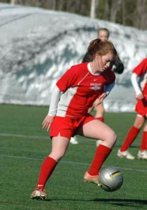 elite girls club soccer players in the snow