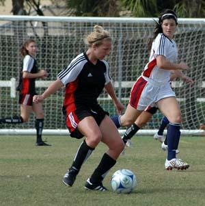 girls club soccer players compete