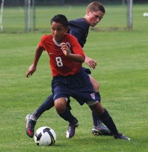 elite boys club soccer players compete.