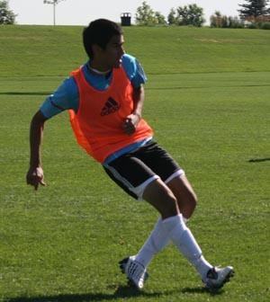 Boys club soccer player competes.
