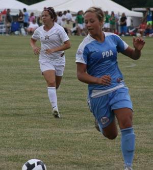 Girls club soccer players compete in a club soccer tournametn.