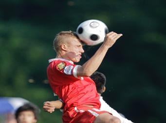 Boys club soccer players compete in a club soccer tournament.