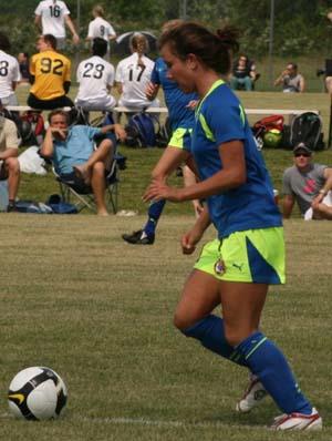 Girls club soccer player competes in a club soccer tournament.