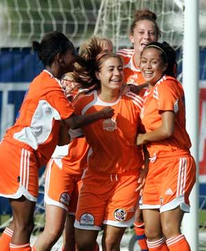 Girls club soccer players in a soccer tournament.