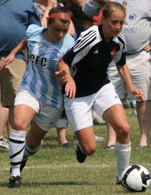 Elite club girls soccer players compete.