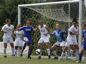 Girl elite club soccer players compete.