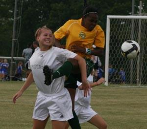 Elite club girl soccer players compete.