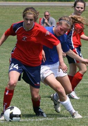 Elite club girl soccer players compete.