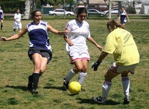 Adult club soccer players compete.