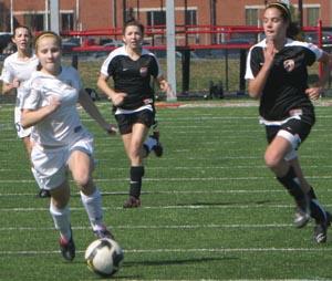 Elite club soccer players compete.