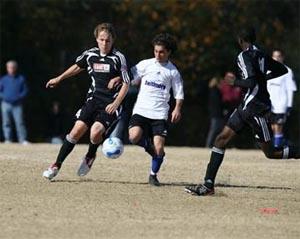 Elite club soccer players compete.