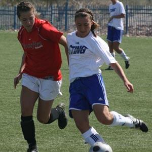 Elite club soccer players compete.