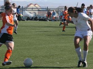 Elite club soccer players compete.