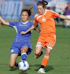 Elite club soccer players compete.