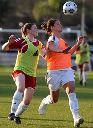 Elite club soccer players compete.