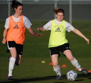 Elite club soccer players compete.